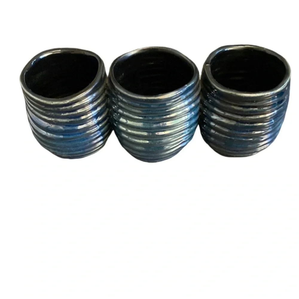 Decorative  clay, metallic blue container. 3 combined vases/cups.